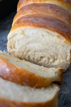 sliced loaf of bread sitting on top of a counter