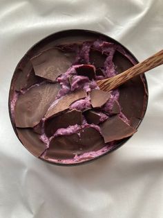 a bowl filled with chocolate and purple food