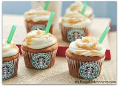 starbucks cupcakes with white frosting and green straws