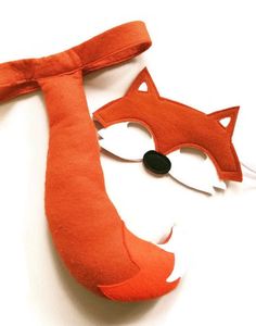 an orange fox mask with a black nose