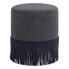 a grey ottoman with fringe trim on the bottom and black velvet upholstered around it