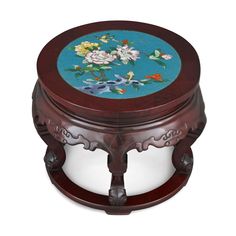 an ornate wooden box with flowers painted on it