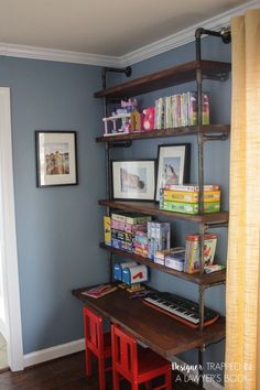 a room with blue walls and shelves filled with books