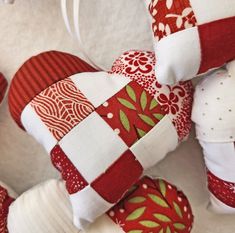 several red and white ornaments are arranged together