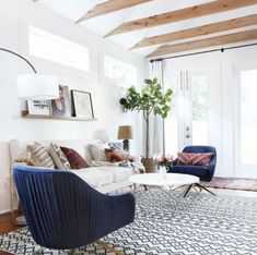 a living room filled with furniture and a rug