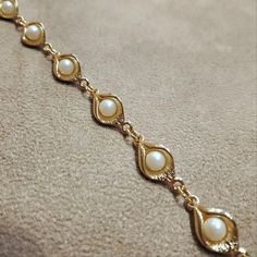 "A pretty vintage glass pearl bracelet in the form of Cala lilies Glass pearls set on gold plated costume metal. 1.2cm wide by 7\" (17.8cm) around the wrist. We can make it smaller by taking links out.    Our shop is in London, Portobello Road, Notting Hill. International shipping takes 5-7 days unless sent with Fedex." Vintage Pearl Bracelet For Formal Occasions, Wedding Pearl Bracelet With Metal Charm, Gold Oyster Pearl Bracelet For Formal Occasions, Gold Pearl Oyster Bracelet For Formal Occasions, Formal Gold Pearl Bracelet With Oyster Design, Wedding Metal Bracelets With Pearl Charm, Gold Pearl Charm Bracelet For Wedding, Wedding Pearl Charm Bracelets, Gold Pearl Bracelet With Pearl Charm For Formal Occasions