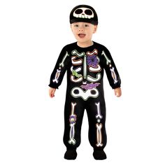 a little boy wearing a black skeleton costume with sunglasses and a hat on his head