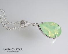 Wedding Swarovski Mint Green Opal Light Green Pastel Green Color Teardrop Crystal Rhinestone Pendant with .925 Sterling Silver Chain Necklace. LANA CHAYKA SHOP: https://www.etsy.com/shop/LanaChayka?ref=seller-platform-mcnav Classy and elegant, this necklace would be perfect for any wedding or occasion! CHAIN is 18 inches (45.7 cm) long, PENDANT is about 1 inch (2.5 cm) long including bail. MATCHING EARRINGS: https://www.etsy.com/listing/188438477/chrysolite-opal-crystal-earrings-light?ref=shop_h Green Teardrop Pendant Necklace For Wedding, Green Teardrop Bridal Necklace For Wedding, Green Pastel, Wedding Pendant, Art Deco Necklace, Green Jewelry, Sterling Silver Chain Necklace, Green Opal, Bridesmaid Wedding