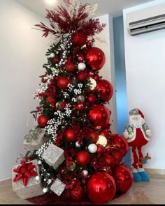 a christmas tree decorated with red and white ornaments