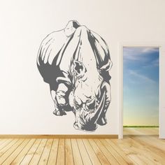 a rhinoceros wall decal in a room with an american flag on the floor