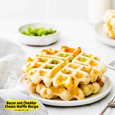 a plate with waffles and peas on it