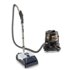 a black and white vacuum is next to a duster on a white background,