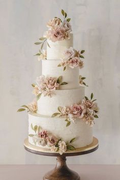 a three tiered cake with flowers on it