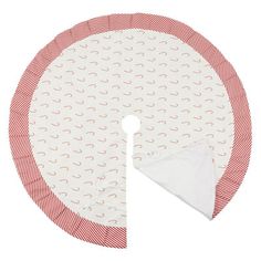 a red and white round tablecloth with circles on the bottom, one circle is folded up