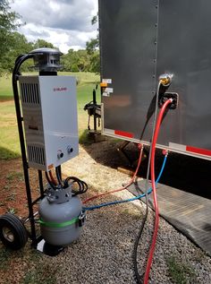 an air compressor attached to the back of a trailer