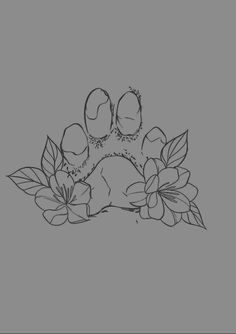 a black and white drawing of a dog paw with flowers on it's side