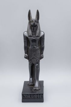 an egyptian statue is shown on a white background