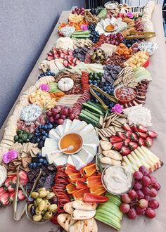 a long table covered in lots of different types of food