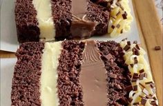 three slices of chocolate cake with white frosting