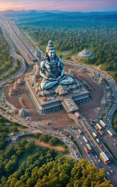 an aerial view of a large buddha statue in the middle of a highway with traffic