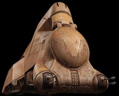 a wooden model of a space ship