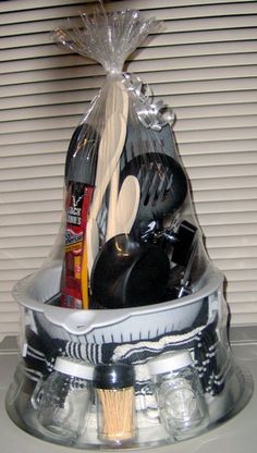 a plastic container filled with cooking utensils on top of a white countertop