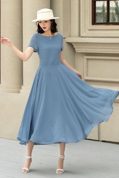 This chiffon dress is a vision of grace and elegance, presented in a serene sky blue that evokes the tranquility of a clear day.  The lightweight chiffon material adds an airy and ethereal quality to the dress, making it an ideal choice for occasions that call for a blend of comfort and refined style. DETAILS * Made of Chiffon fabric, fully chiffon liner * Midi dress * Without pockets * Fitted waist to show off your curves * Concealed Back zip closure  * Perfect for summer * Wash by hand or machine with cold water MODEL SIZE Bust:85 cm(33.4") Waist:67 cm(26.7") Height: 168cm(5'6") She wears size XS CUSTOM MADE SERVICE If you * Need a tailored clothes with your body measurement * Need a Better fit * Can't find your size in the size Chart * Make this clothes in other Color * Change the style Simple Modest Dresses, Blue Flowy A-line Chiffon Dress, Flowy Short Sleeve Chiffon Dress, Short Sleeve Chiffon Dress With Flowy Skirt, Blue A-line Dress With Flowy Skirt, Flowy Short-sleeved Chiffon Dress, Elegant Short Sleeve Chiffon Dress With Flowy Skirt, Elegant Chiffon Dress With Flowy Skirt And Short Sleeves, Flowy Midi-length Chiffon Dress For Formal Occasions