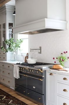 a kitchen with an oven, stove and counter tops in it's center island