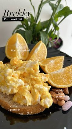 an image of scrambled eggs on toast with oranges