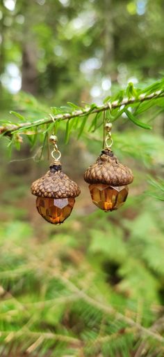 Bring the beauty of the outdoors into your Fall look with these captivating acorn earrings. The intricate, nature-inspired design adds an enchanting, earthy elegance that's perfect for the crisp, colorful days of Fall. Wear them to the office, out with friends, or to your next seasonal celebration - these earrings will elevate any ensemble with their timeless charm. Acorn earrings measure approximately 40mm from top of bead and loop wire to bottom of earring bead, and approximately 17mm wide at Cool Bead Designs, Acorn Cap Earrings, Fall Bead Jewelry, Crafty Gift Ideas For Friends, Nature-inspired Dangle Earrings, Nature-inspired Natural Color Drop Earrings, Brown Dangle Earrings Nature-inspired, Nature-inspired Dangle Earrings In Natural Color, Natural Dangle Earrings, Nature-inspired