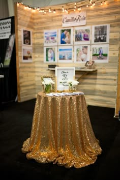 the table is covered with gold sequins and has pictures on it that say congratulations