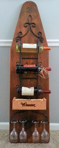 the wine rack is made from an old wooden board