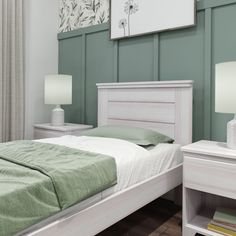 a bedroom with green walls and white furniture