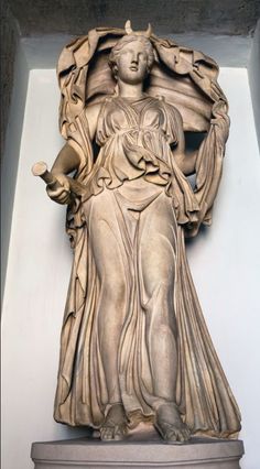 a statue is shown in the corner of a room