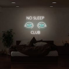 there is a neon sign that says no sleep club on the wall above a bed