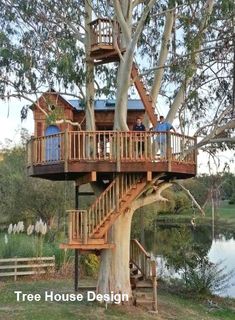 a tree house with stairs leading up to the upper deck and second story above it