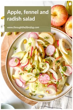 an apple and radish salad in a white bowl