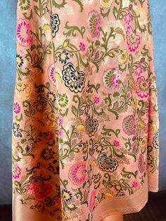 Paithani Style Floral Semi Banarasi Silk Dupatta. Meenakari Work with gold Zari Work. Handloom Dupatta, very light weight and soft. Item: DupattaBase color : Light Peach Fabric : Banarasi Semi Soft Silk (Not Pure Silk)Work : Weaved with tasselsLength of the Dupatta : 88 inches approx.Width of the dupatta : 35inches (Approx.)Please note there are threads on the back side of the dupatta. Store Policies- No return or exchange will be accepted for color variations.- No return or exchange will be acc Traditional Peach Lehenga For Eid, Multicolor Brocade Traditional Wear With Meenakari, Peach Traditional Wear With Traditional Drape, Festive Peach Traditional Wear, Festive Peach Dupatta With Zari Weaving, Festive Peach Dupatta With Pallu, Peach Traditional Wear With Pallu For Festivals, Peach Traditional Wear For Festivals, Traditional Peach Dupatta With Zari Work