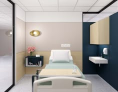 a hospital room with a bed, sink and mirror on the wall next to it