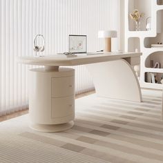 a white desk with a laptop on it in front of a bookcase and shelves