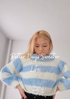 a woman wearing a blue and white striped sweater with the words better days sweater lite