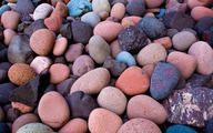 many different colored rocks on the ground