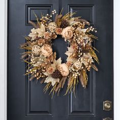 a wreath is hanging on the front door