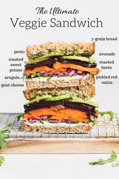 the ultimate veggie sandwich is stacked on top of each other with different ingredients