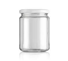 an empty glass jar with a white lid