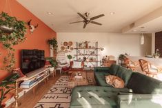 a living room filled with furniture and a flat screen tv