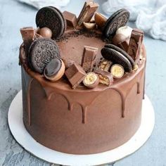 a chocolate cake with cookies and oreo pieces on top