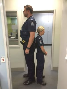 two police officers standing next to each other in an office hallway with the caption protection come in all shapes and sizes