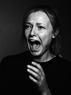 black and white photograph of a woman with her mouth open