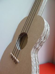 an instrument made out of cardboard and string